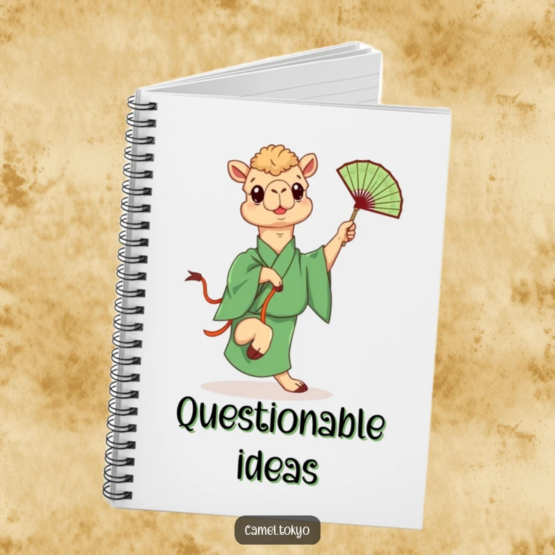 Funny notebook featuring a camel in a green kimono playfully kicking a fan, perfect for writing with humor.